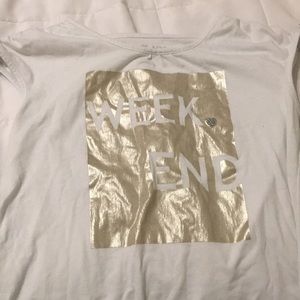 A white tee with a ties on the sleeves.